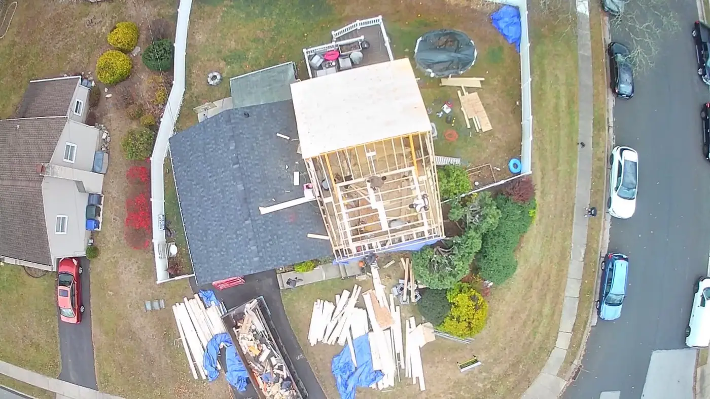 Aerial view over an Abington, PA neighborhood during a third-story addition