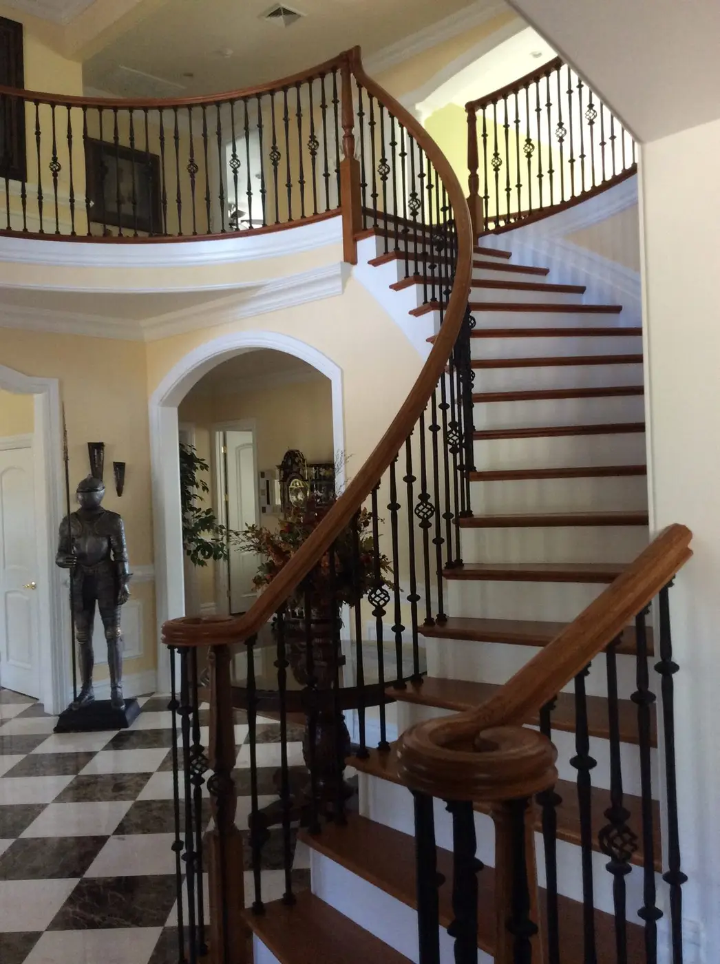 Curved staircase and balcony inside the Hilltown, PA custom home